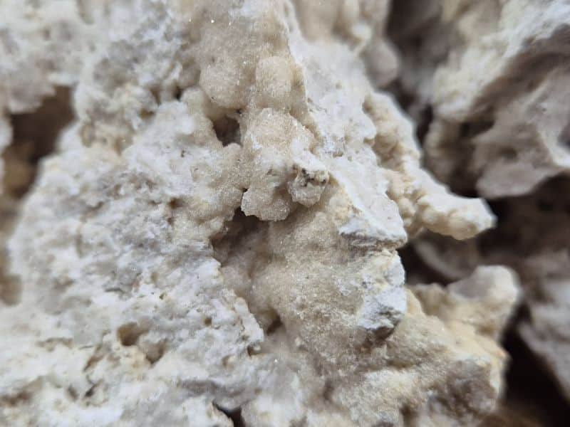 Close-up of natural aragonite crystal patches on Calcium Stone for isopod and millipede enclosures