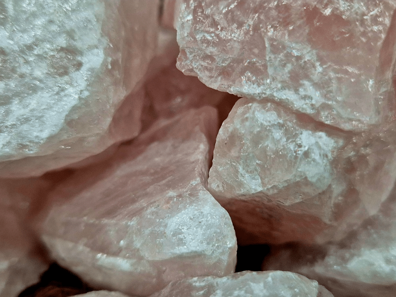 Close-up of raw Rose Quartz crystal with natural pale pink mineral texture