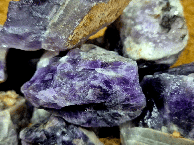 Close-up of natural raw Amethyst crystal with purple mineral patterning