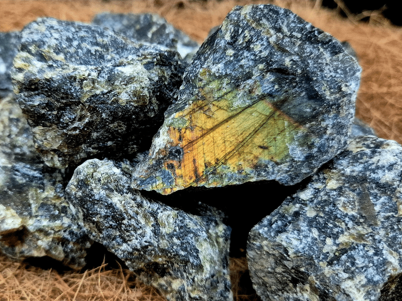 Raw Labradorite crystal showing natural gold and green iridescent flash